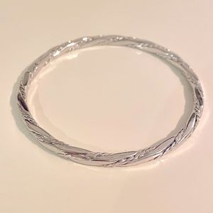 Vintage MONET twisted rope silver tone bangle bracelet.